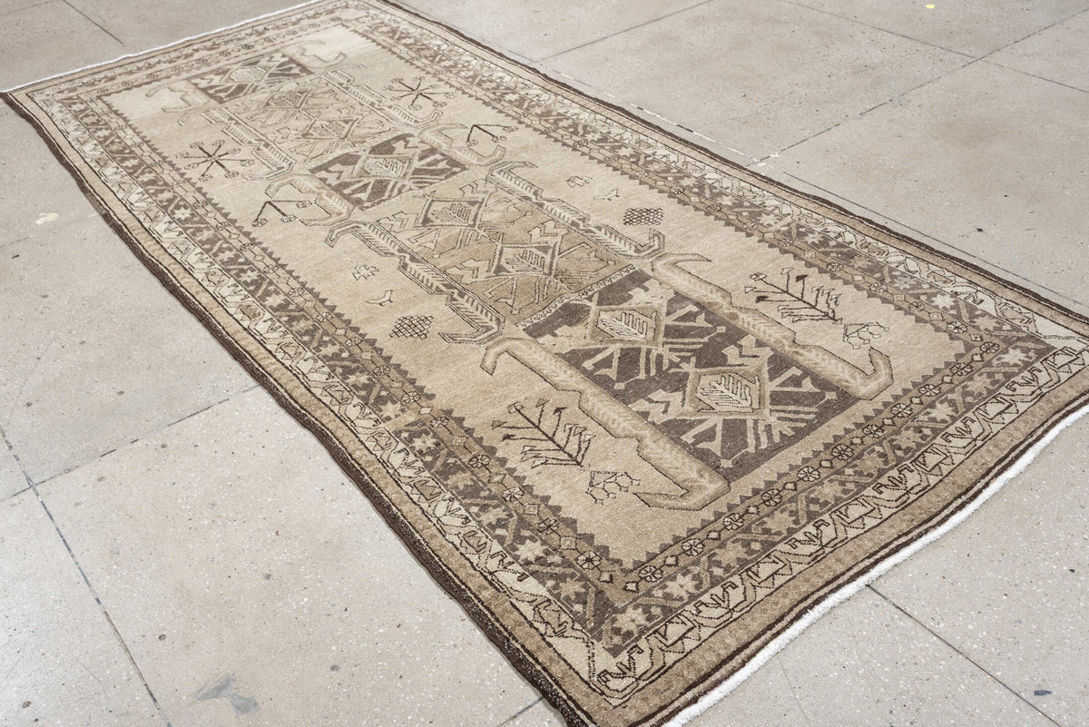 4' x 10' one-of-a-kind handmade antique Saraband runner rug. Color palette: ivory, taupe, brown, camel, charcoal, beige