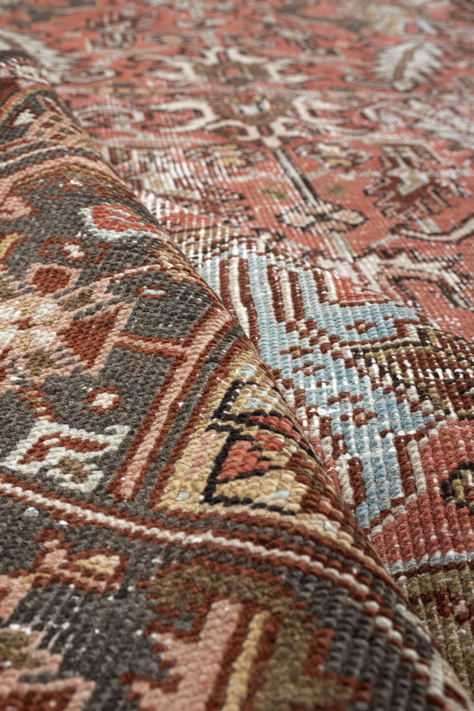 6' x 8' one-of-a-kind handmade antique Heriz rug. Color palette: terracotta, charcoal, ivory, rust, olive, light blue, camel