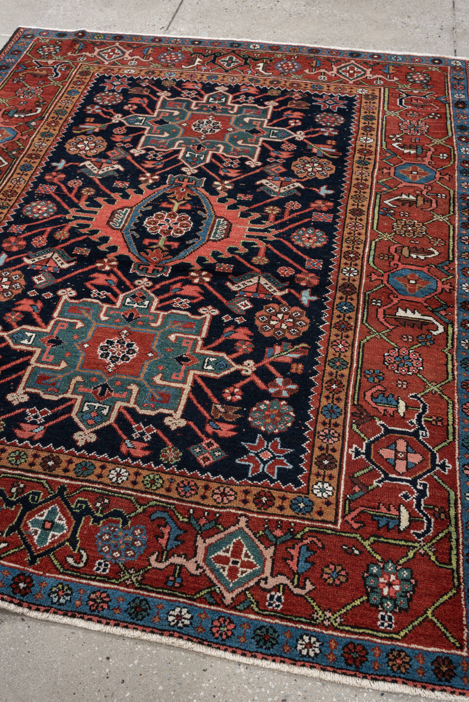 4' x 6' one-of-a-kind handmade antique Karaje rug. Color palette: rust, navy, sky blue, ivory, coral, camel, sage, charcoal