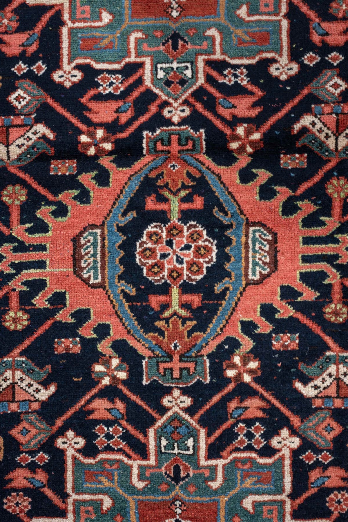 4' x 6' one-of-a-kind handmade antique Karaje rug. Color palette: rust, navy, sky blue, ivory, coral, camel, sage, charcoal