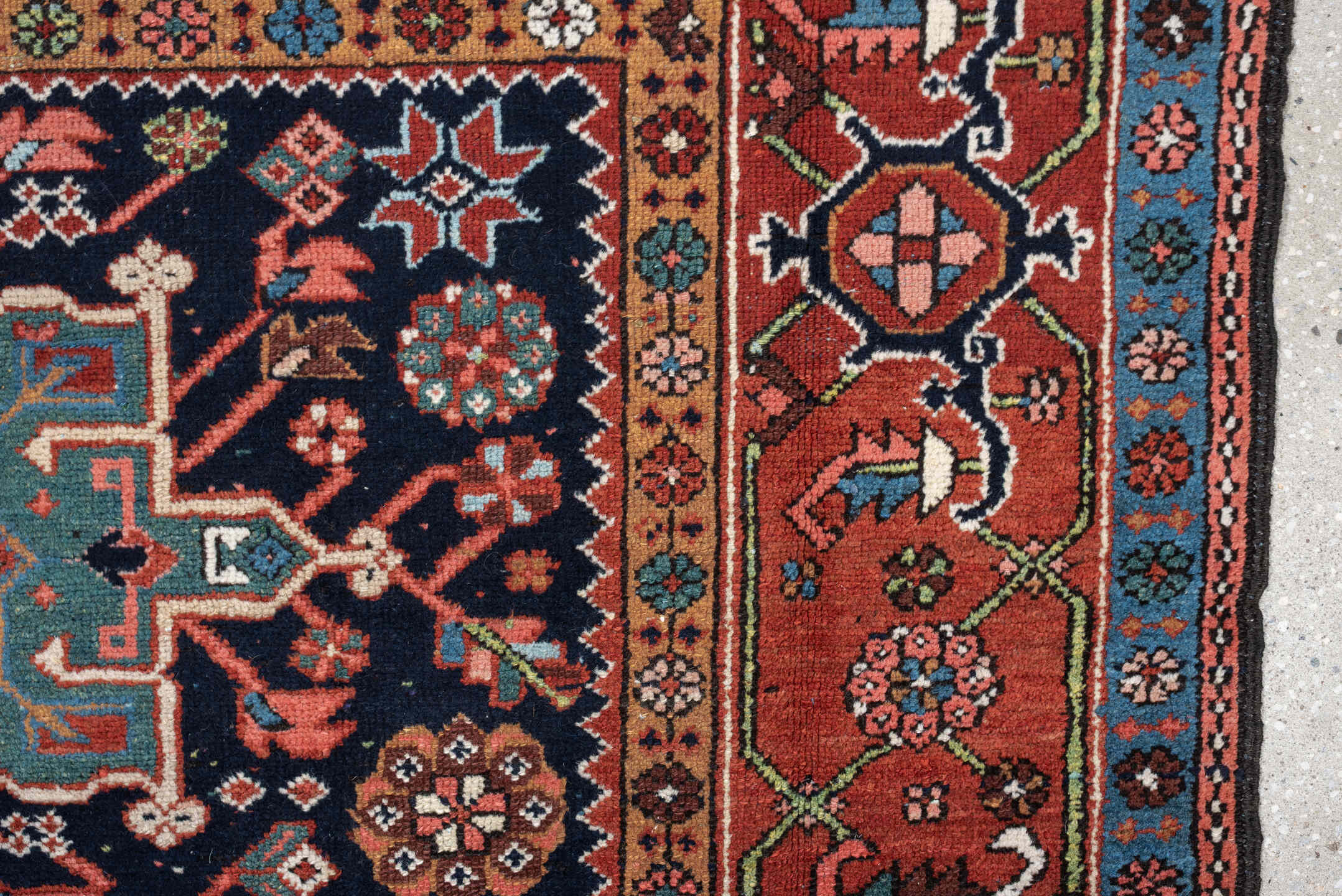 4' x 6' one-of-a-kind handmade antique Karaje rug. Color palette: rust, navy, sky blue, ivory, coral, camel, sage, charcoal