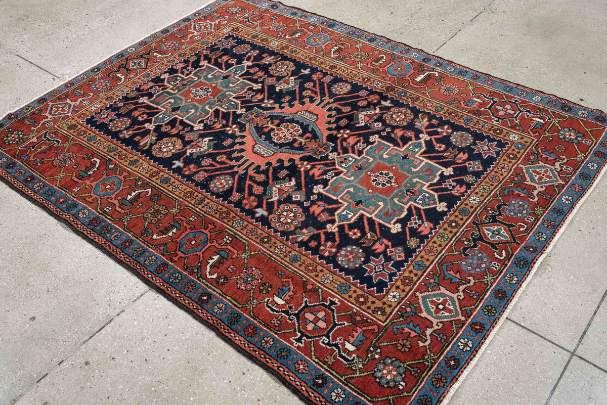 4' x 6' one-of-a-kind handmade antique Karaje rug. Color palette: rust, navy, sky blue, ivory, coral, camel, sage, charcoal