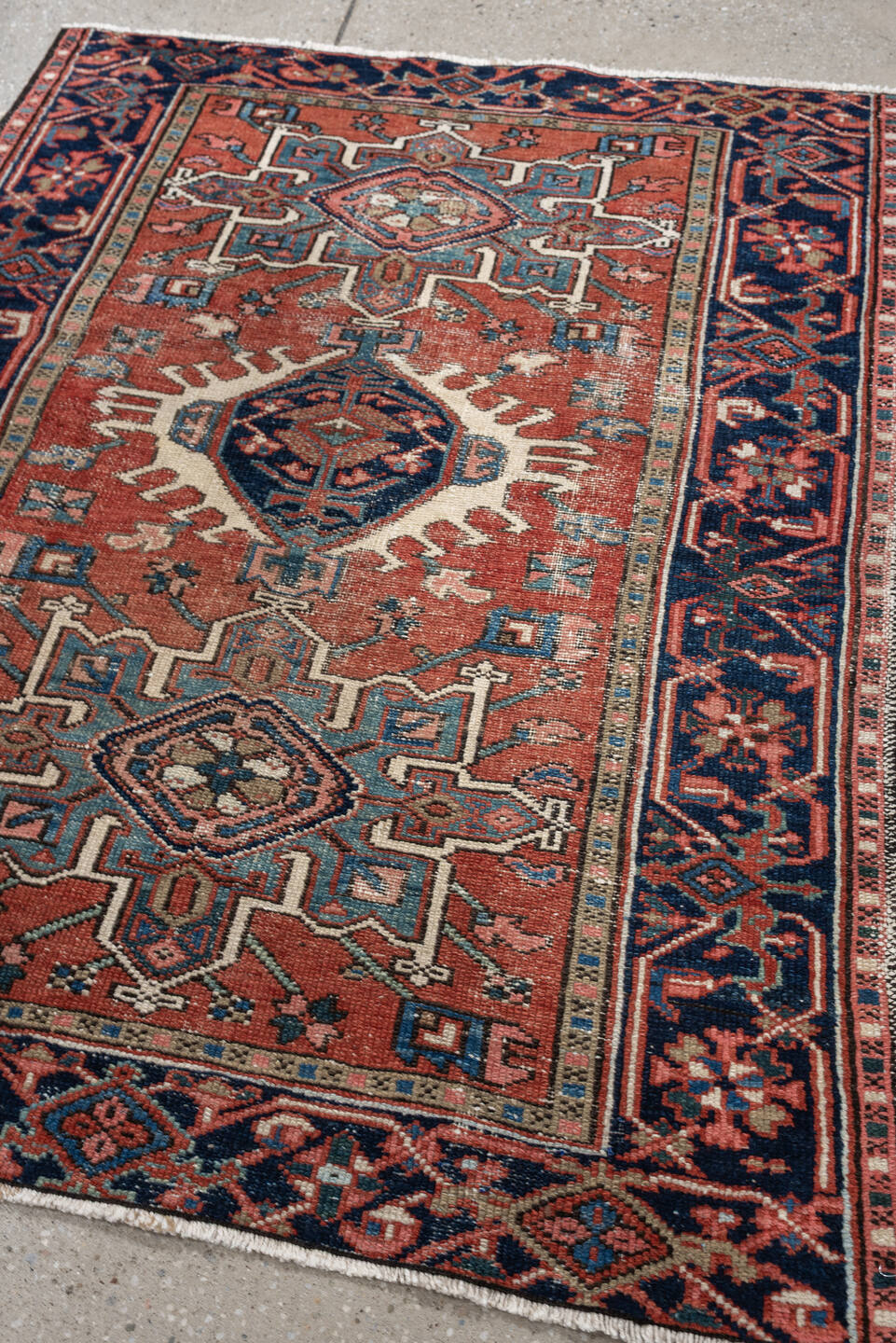 3' x 4' one-of-a-kind handmade antique Karaje small size rug. Color palette: terracotta, navy, ivory, light blue, rust