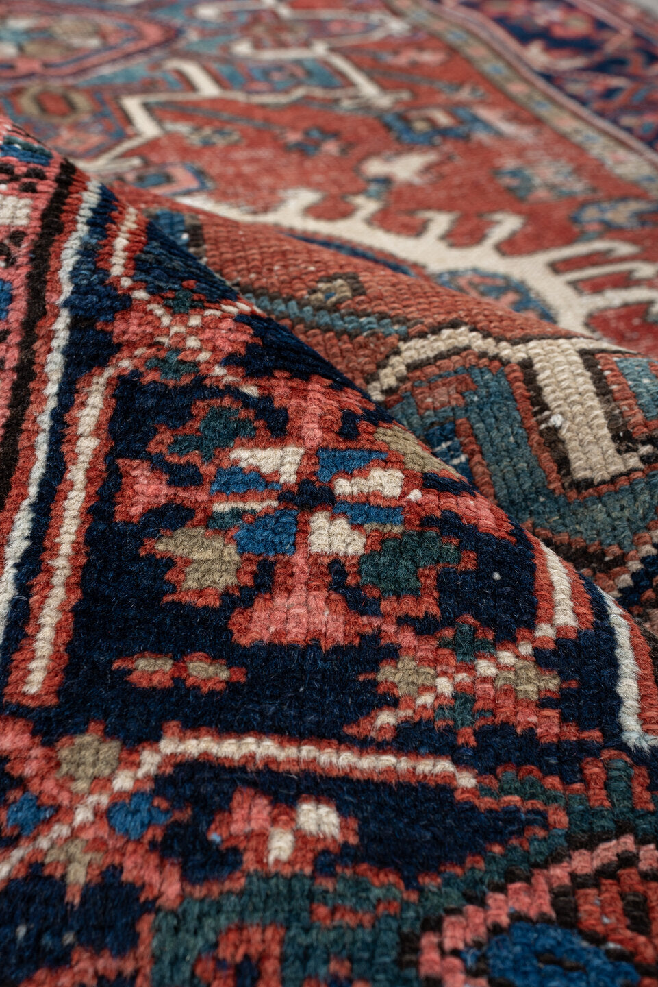 3' x 4' one-of-a-kind handmade antique Karaje small size rug. Color palette: terracotta, navy, ivory, light blue, rust