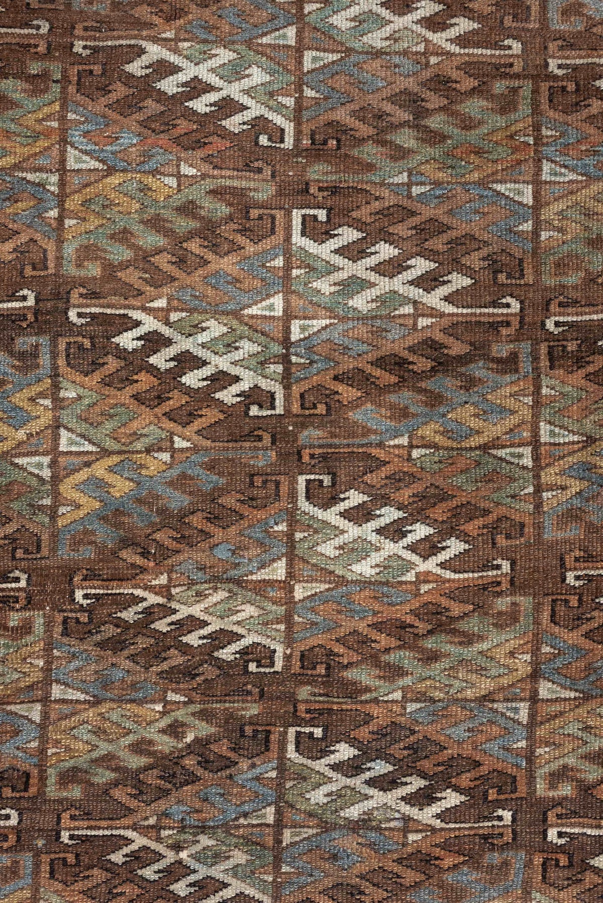 7' x 10' one-of-a-kind handmade antique Yamoud large size rug. Color palette: brown, camel, ivory, muted teal, rust, taupe