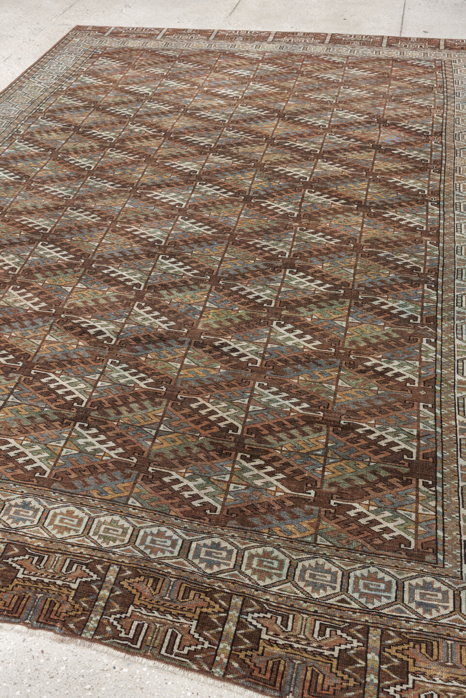 7' x 10' one-of-a-kind handmade antique Yamoud large size rug. Color palette: brown, camel, ivory, muted teal, rust, taupe