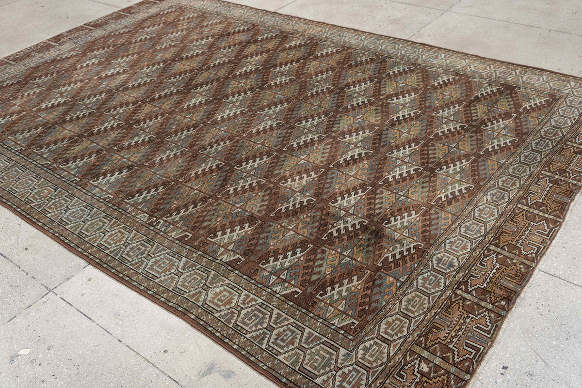 7' x 10' one-of-a-kind handmade antique Yamoud large size rug. Color palette: brown, camel, ivory, muted teal, rust, taupe