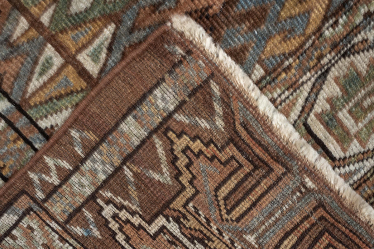 7' x 10' one-of-a-kind handmade antique Yamoud large size rug. Color palette: brown, camel, ivory, muted teal, rust, taupe