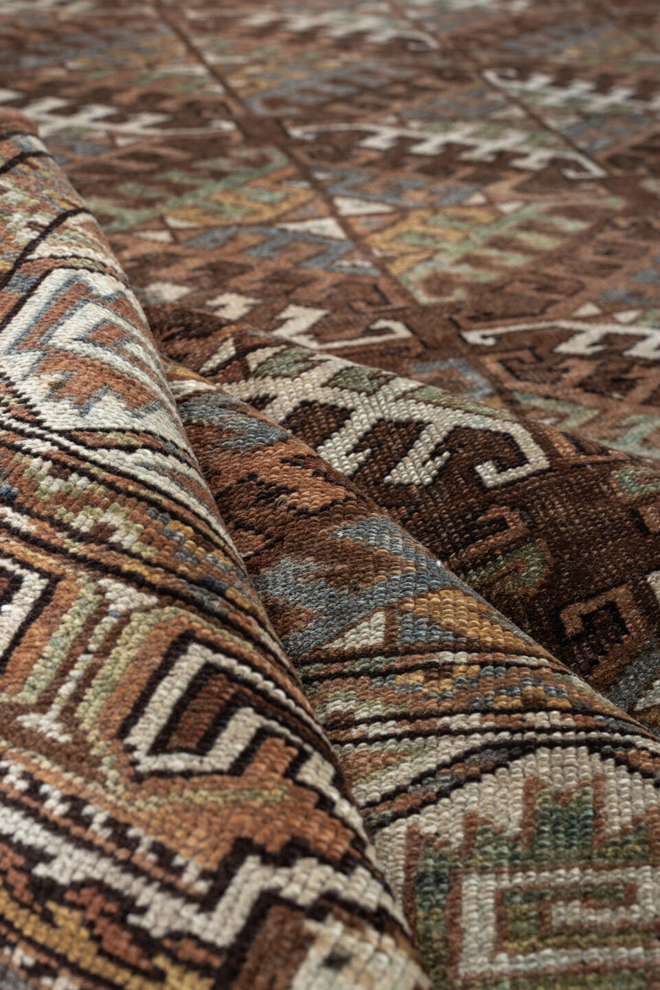7' x 10' one-of-a-kind handmade antique Yamoud large size rug. Color palette: brown, camel, ivory, muted teal, rust, taupe