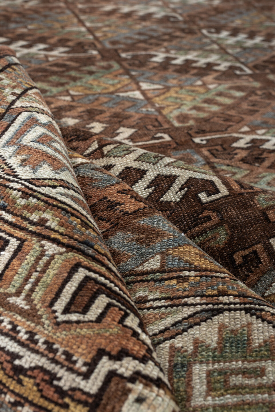 7' x 10' one-of-a-kind handmade antique Yamoud large size rug. Color palette: brown, camel, ivory, muted teal, rust, taupe
