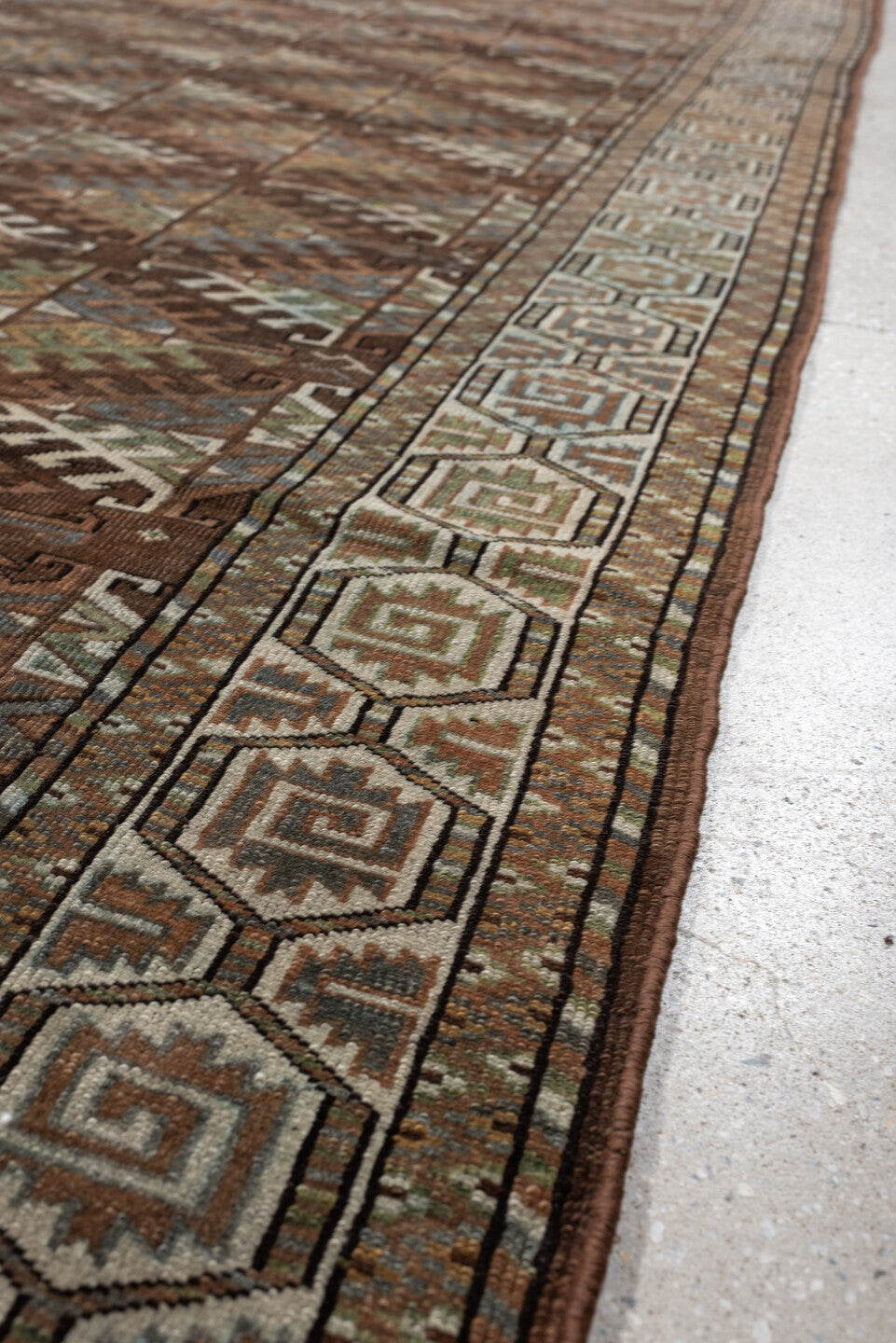 7' x 10' one-of-a-kind handmade antique Yamoud large size rug. Color palette: brown, camel, ivory, muted teal, rust, taupe
