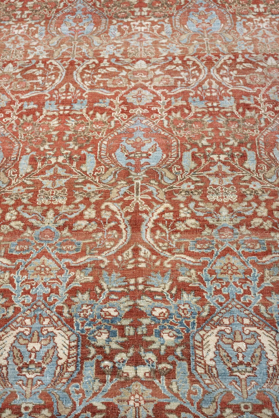 9' x 12' one-of-a-kind handmade antique Baktiary large size rug. Color palette: rust, sky blue, ivory, sage, terracotta