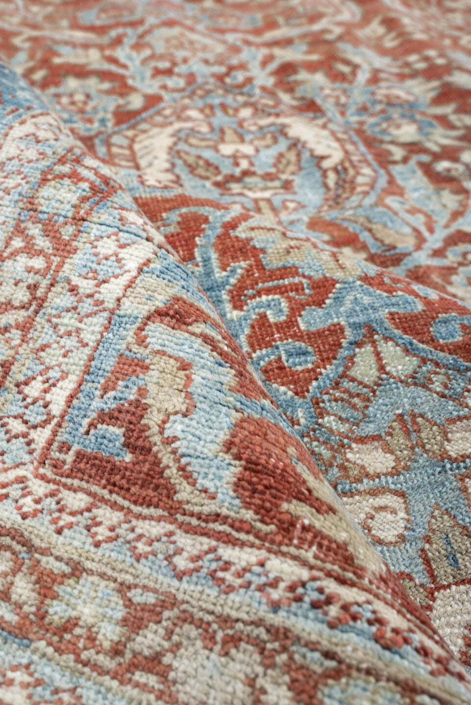 9' x 12' one-of-a-kind handmade antique Baktiary large size rug. Color palette: rust, sky blue, ivory, sage, terracotta