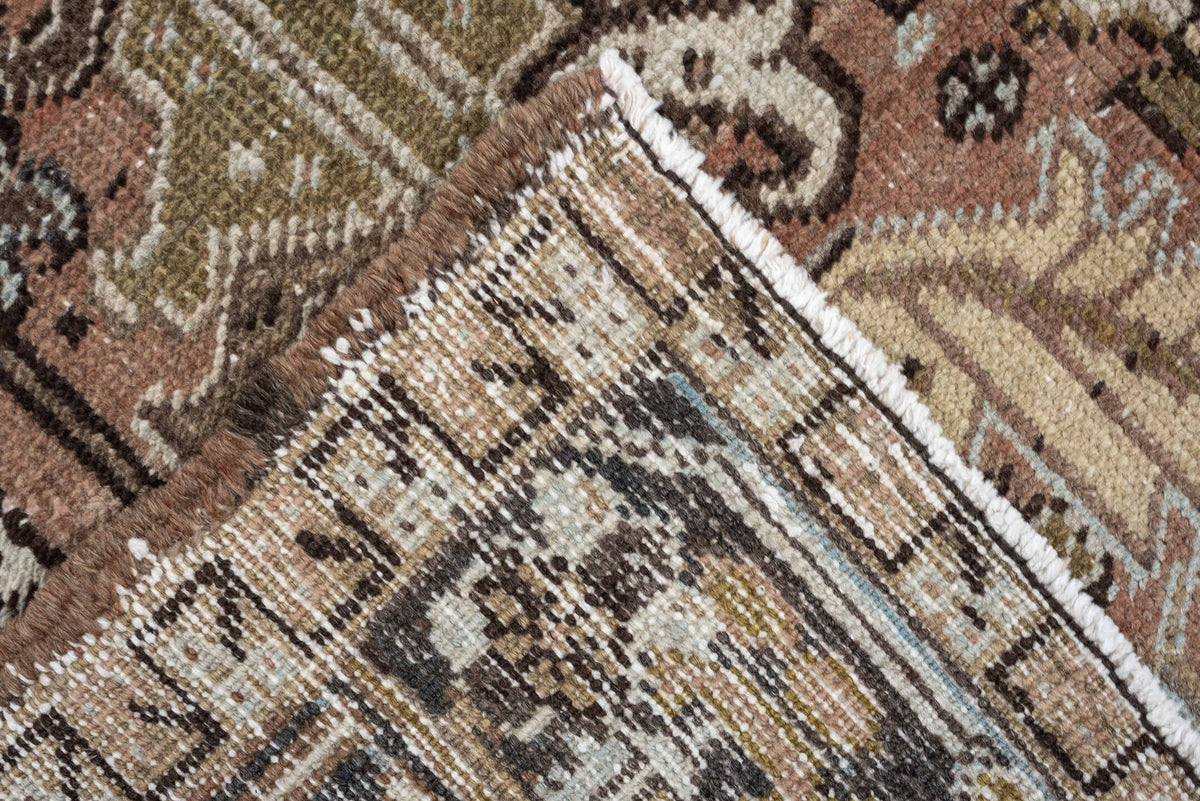 5' x 8' one-of-a-kind handmade antique Heriz medium size rug. Color palette: terra cotta, charcoal, ivory, olive, camel