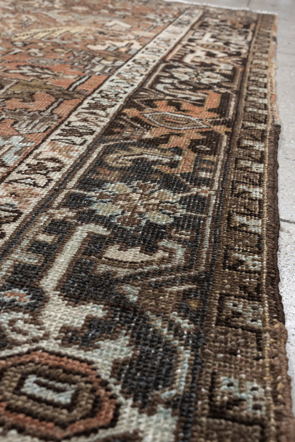5' x 8' one-of-a-kind handmade antique Heriz medium size rug. Color palette: terra cotta, charcoal, ivory, olive, camel