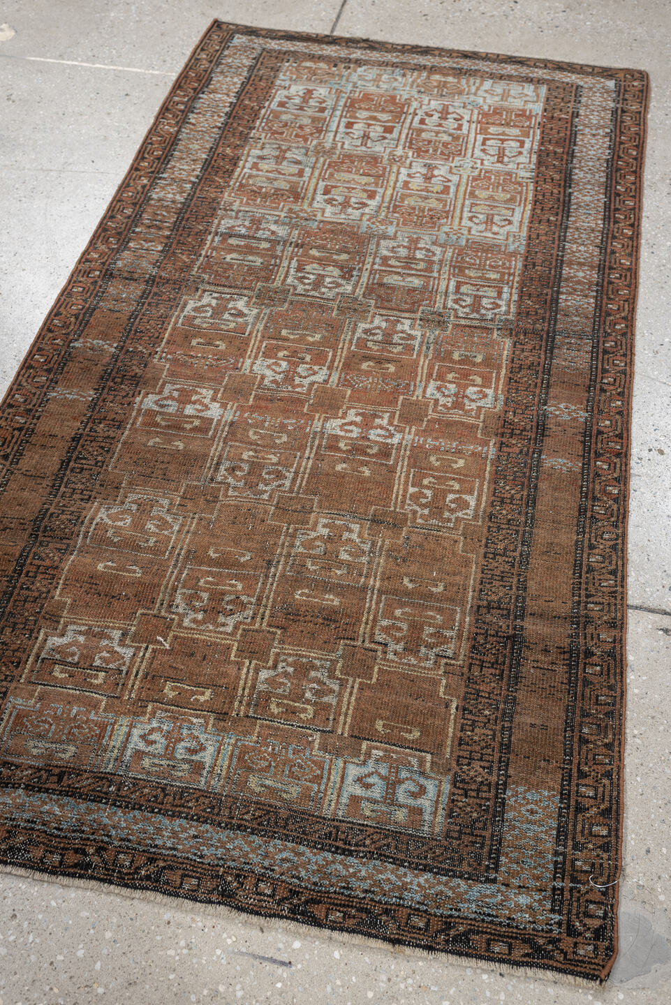 2' x 5' one-of-a-kind handmade antique Belouch small size rug. Color palette: camel, rust, pale blue, ivory, charcoal, taupe