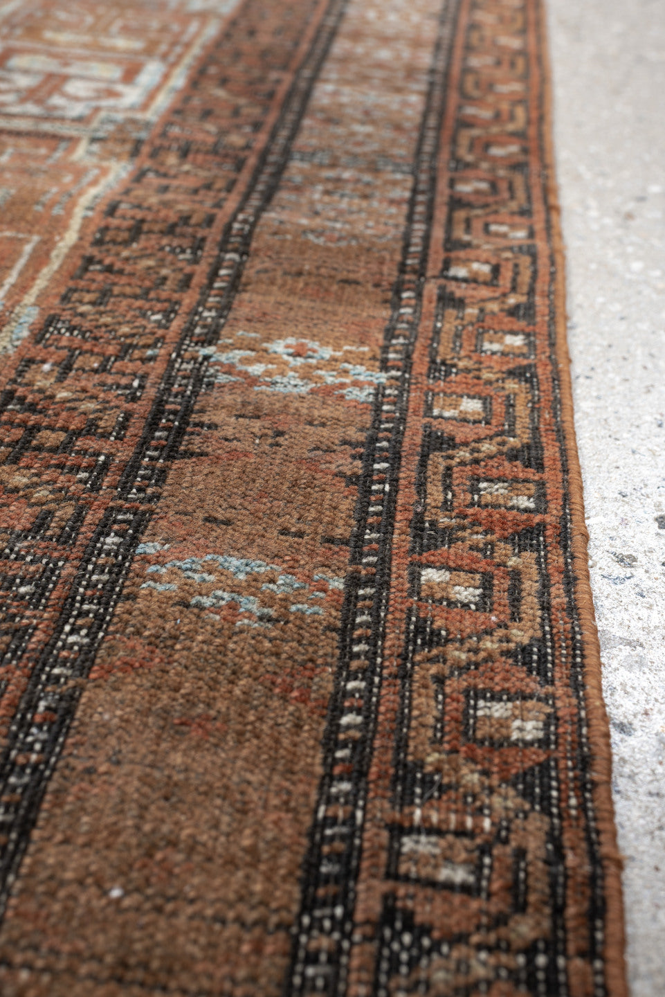 2' x 5' one-of-a-kind handmade antique Belouch small size rug. Color palette: camel, rust, pale blue, ivory, charcoal, taupe