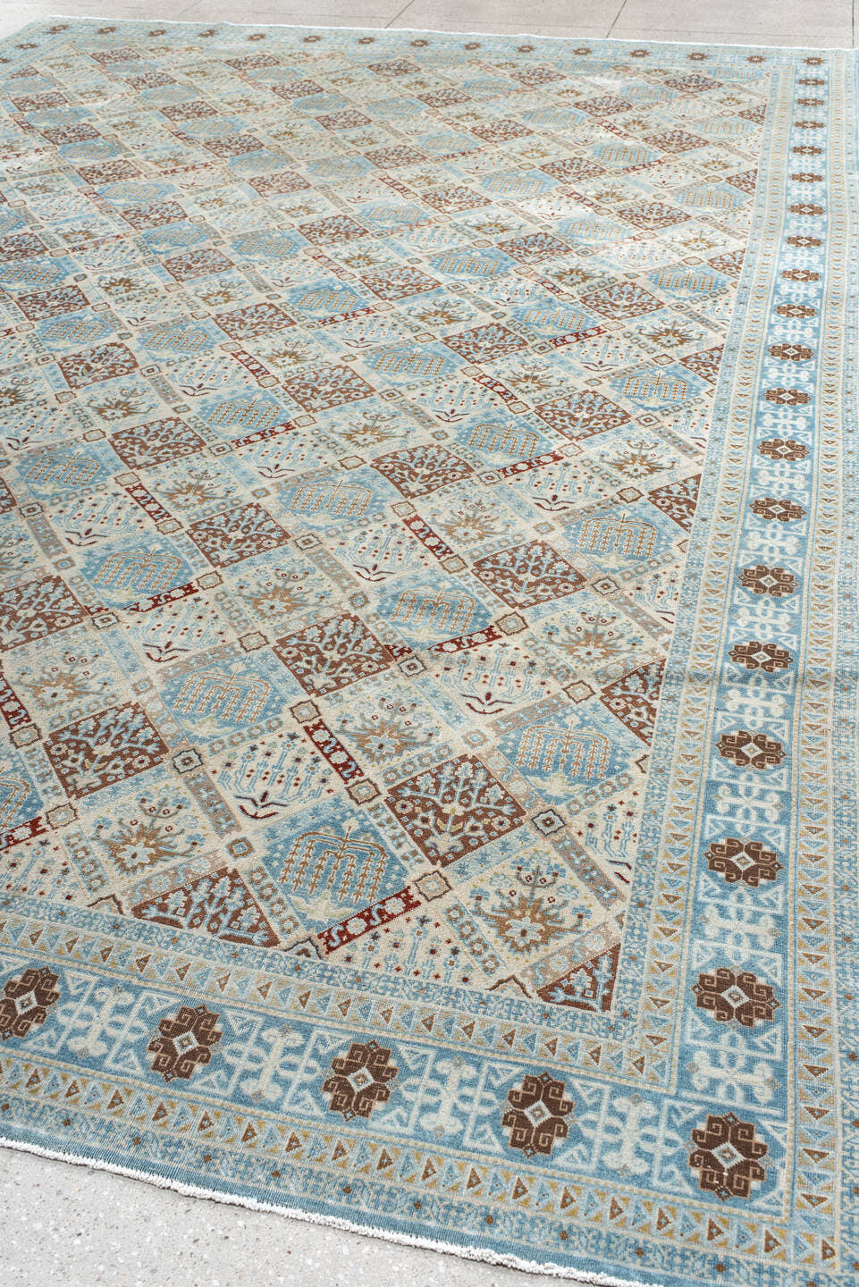 11' x 15' one-of-a-kind handmade vintage Qum oversize rug. Color palette: ivory, sky blue, brown, camel, taupe, rust