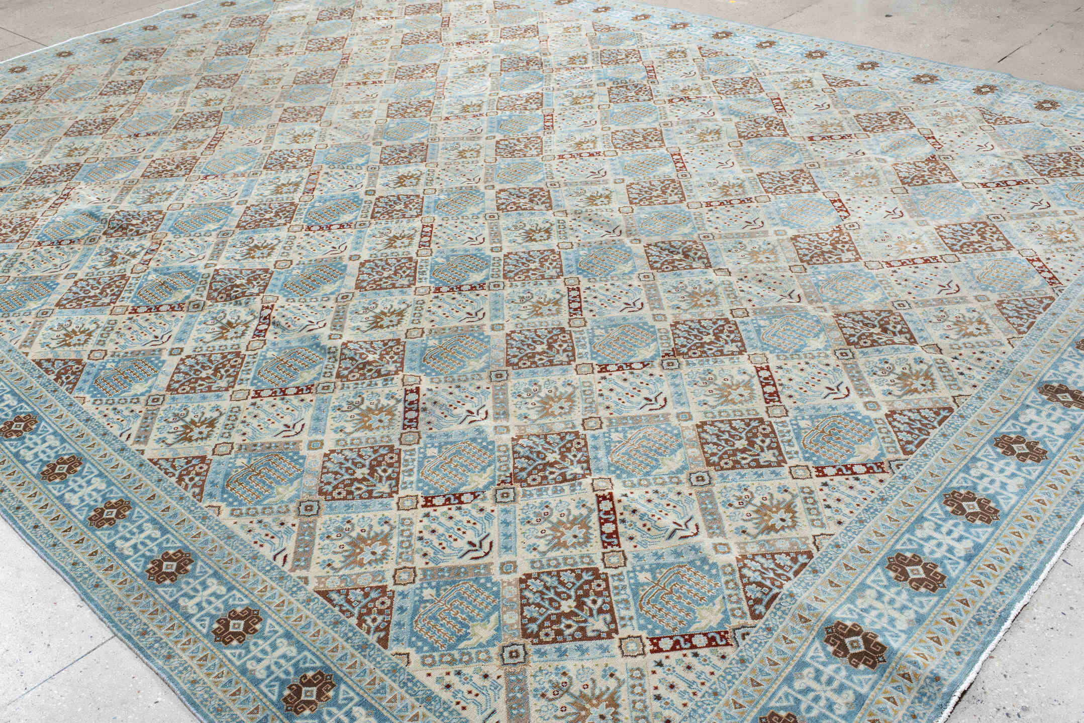 11' x 15' one-of-a-kind handmade vintage Qum oversize rug. Color palette: ivory, sky blue, brown, camel, taupe, rust