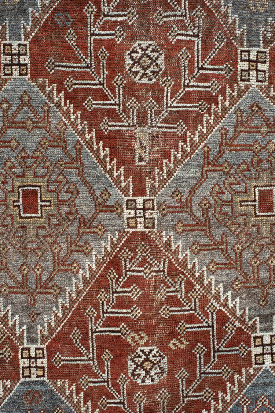 4' x 9' one-of-a-kind handmade antique Shiraz rug. Color palette: rust, sky blue, ivory, brown, taupe, charcoal, terracotta