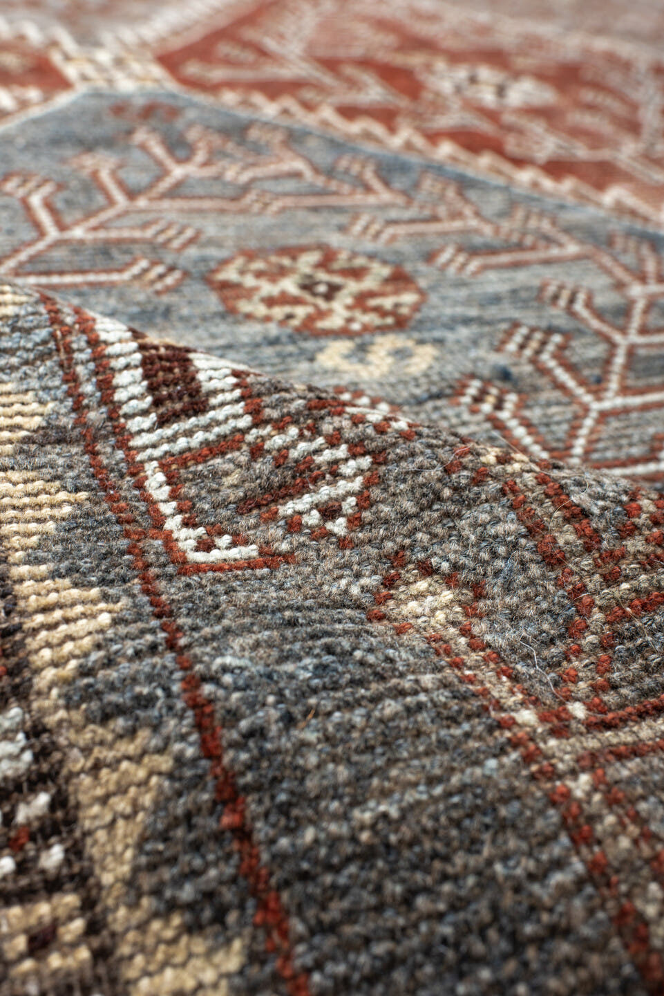 4' x 9' one-of-a-kind handmade antique Shiraz rug. Color palette: rust, sky blue, ivory, brown, taupe, charcoal, terracotta