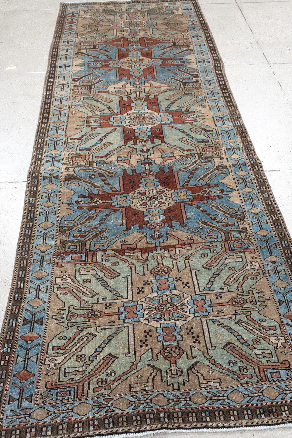 3' x 10' one-of-a-kind handmade vintage Sarab runner rug. Color palette: sky blue, ivory, rust, brown, taupe, charcoal