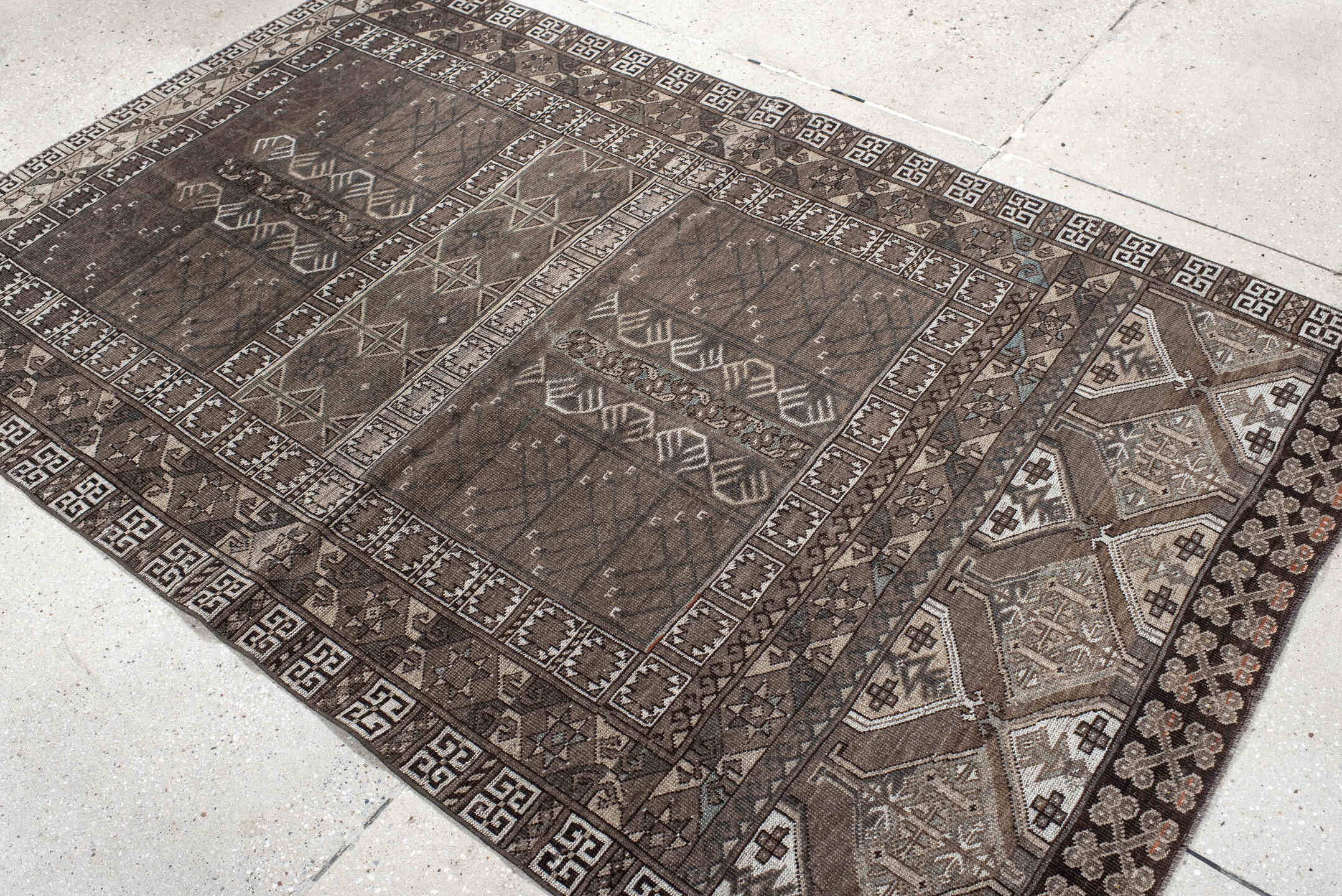 4' x 6' one-of-a-kind handmade vintage Belouch small size rug. Color palette: taupe, brown, ivory, charcoal, camel, slate