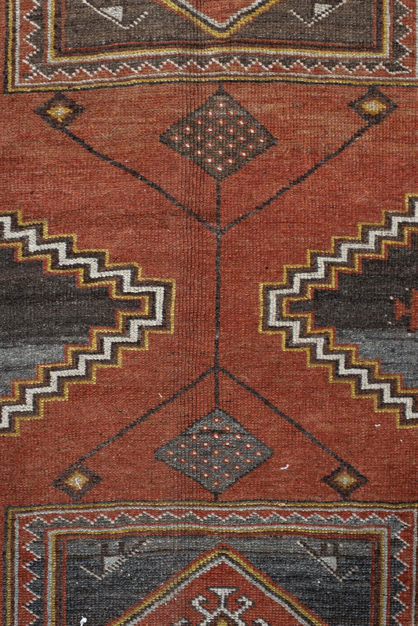 5' x 8' one-of-a-kind handmade vintage Veece medium size rug. Color palette: rust, charcoal, slate, brown, ivory, gold