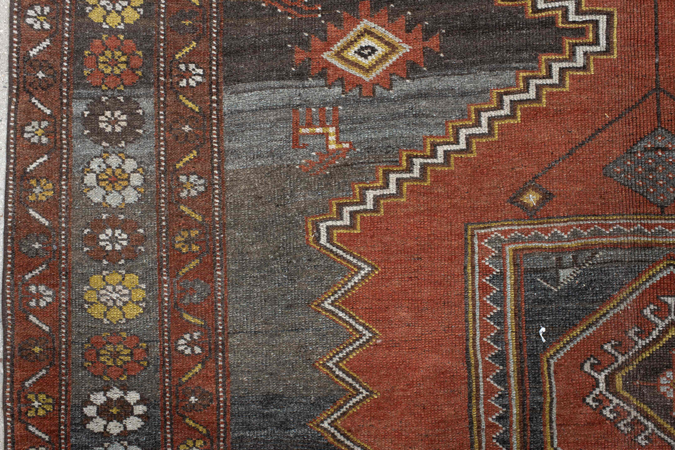 5' x 8' one-of-a-kind handmade vintage Veece medium size rug. Color palette: rust, charcoal, slate, brown, ivory, gold