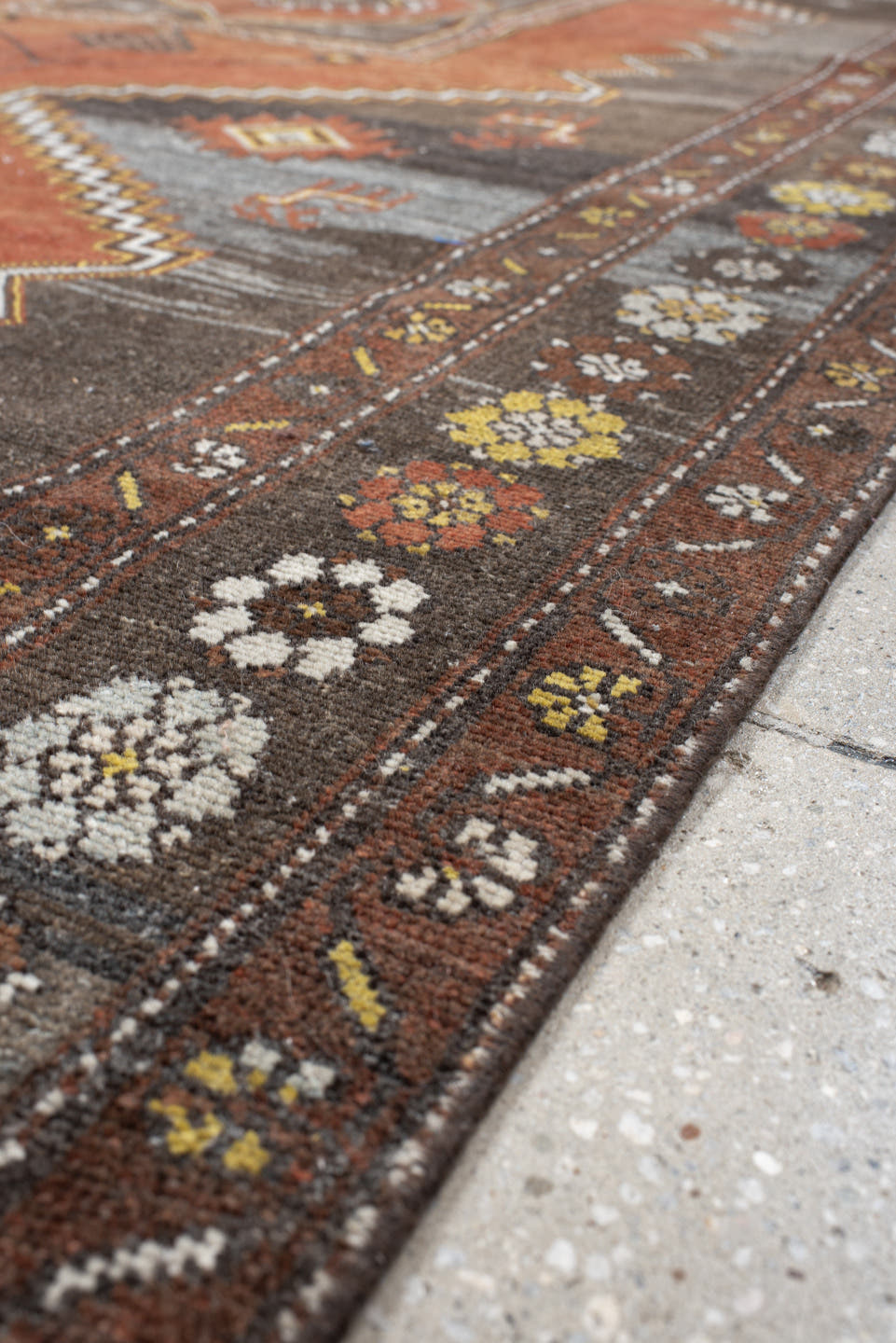 5' x 8' one-of-a-kind handmade vintage Veece medium size rug. Color palette: rust, charcoal, slate, brown, ivory, gold