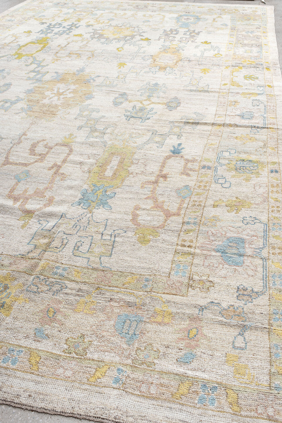 12' x 20' one-of-a-kind handmade vintage Oushak oversize rug. Color palette: ivory, pale blue, gold, sage, blush, taupe