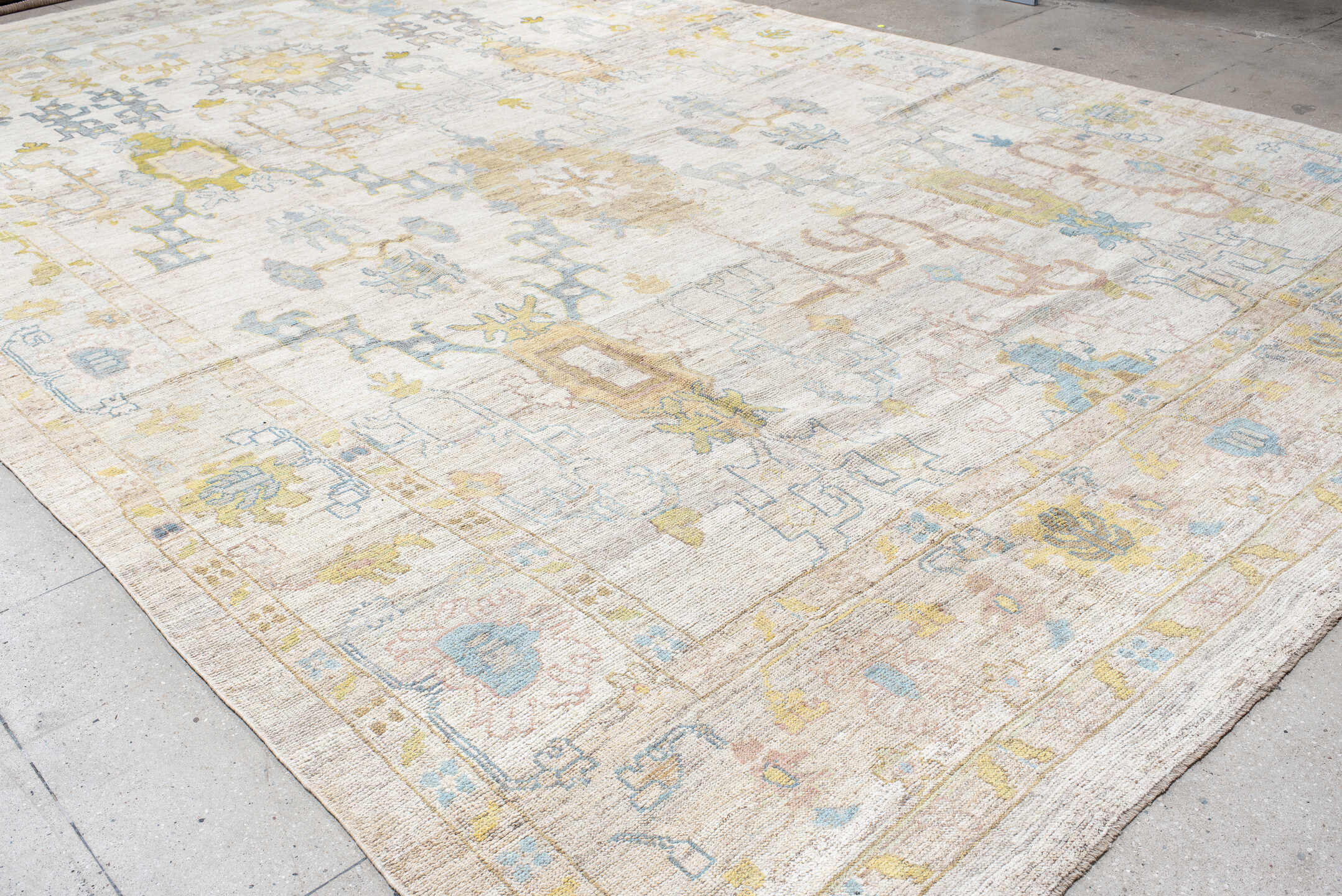 12' x 20' one-of-a-kind handmade vintage Oushak oversize rug. Color palette: ivory, pale blue, gold, sage, blush, taupe