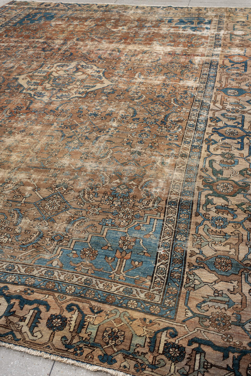 10' x 14' one-of-a-kind handmade vintage Serapi large size rug. Color palette: terra cotta, ivory, blue, beige, camel, slate