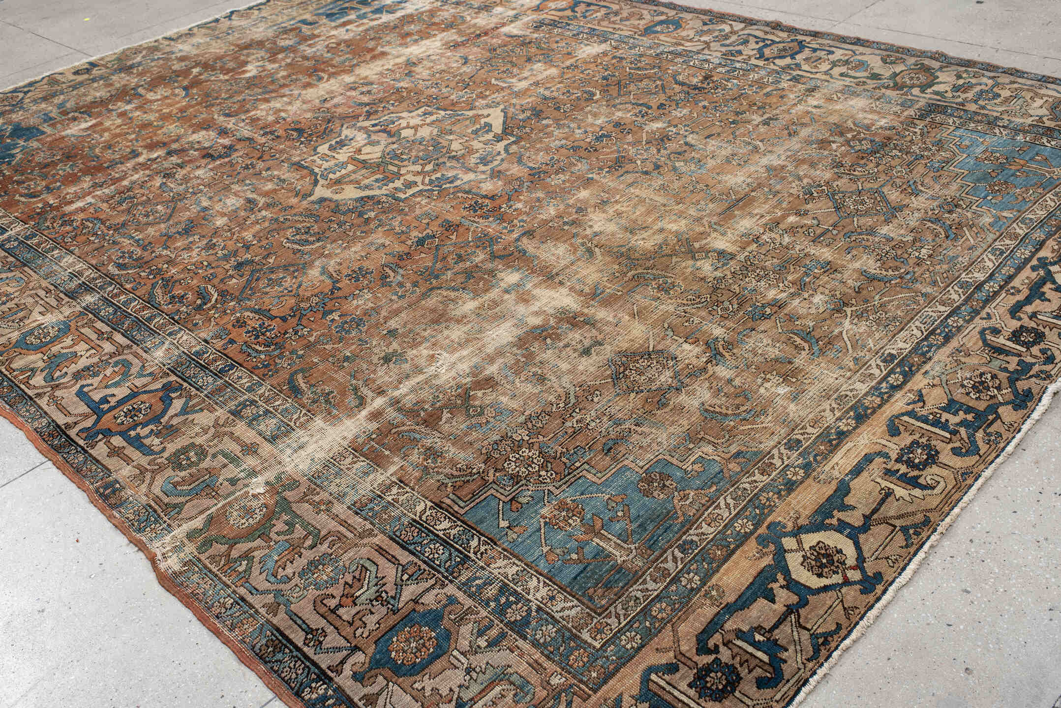 10' x 14' one-of-a-kind handmade vintage Serapi large size rug. Color palette: terra cotta, ivory, blue, beige, camel, slate
