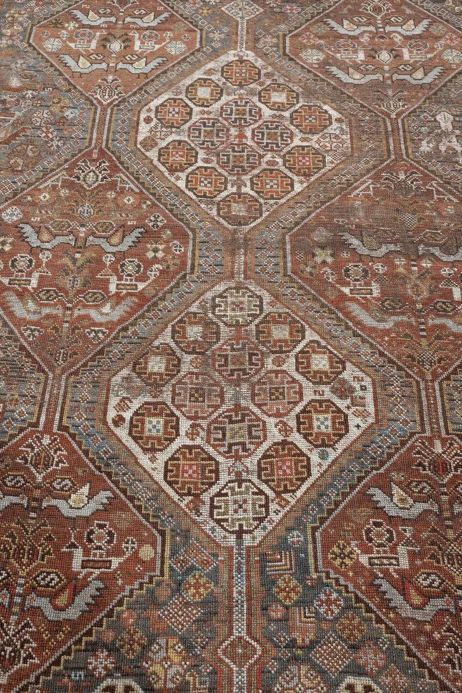 4' x 6' one-of-a-kind handmade antique Qashqai small size rug. Color palette: terracotta, ivory, slate gray, rust, taupe