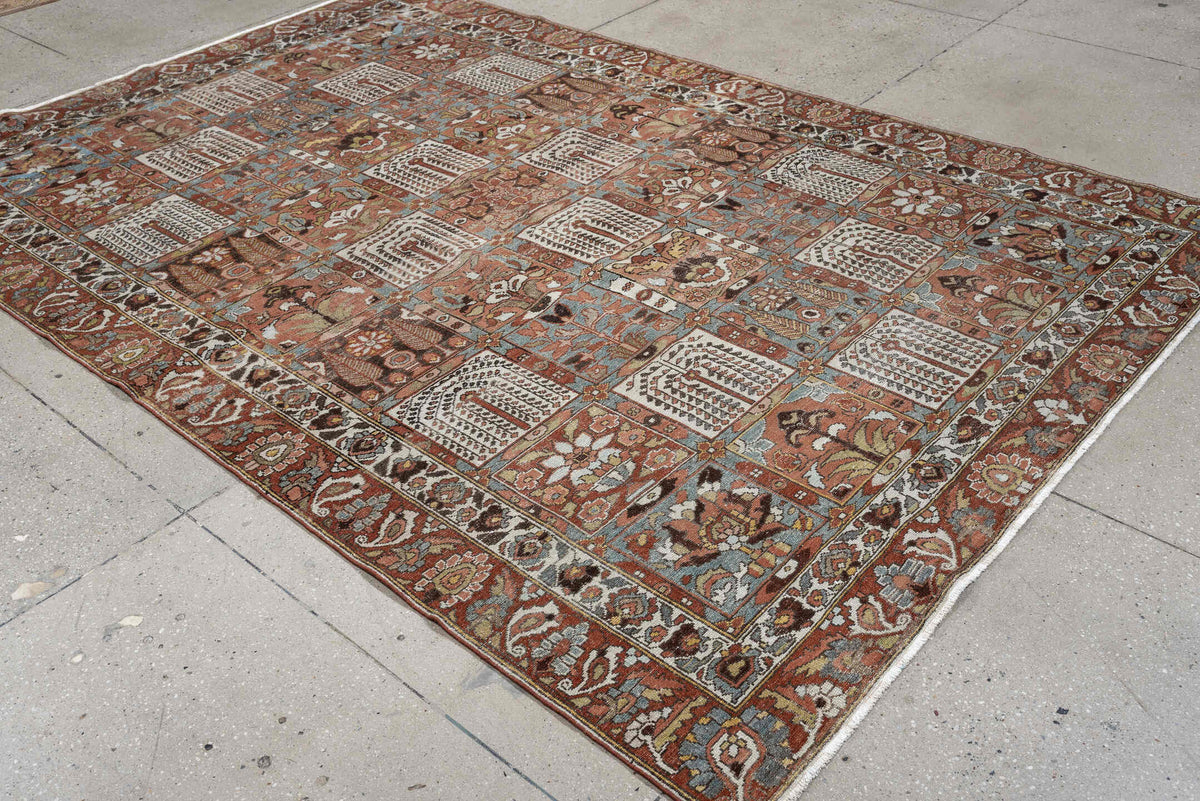 6' x 9' one-of-a-kind handmade antique Baktiary large size rug. Color palette: terracotta, ivory, blue gray, rust, brown