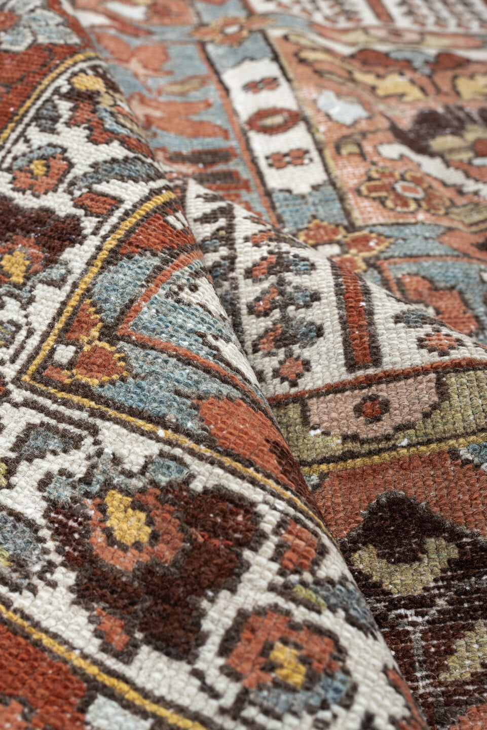 6' x 9' one-of-a-kind handmade antique Baktiary large size rug. Color palette: terracotta, ivory, blue gray, rust, brown