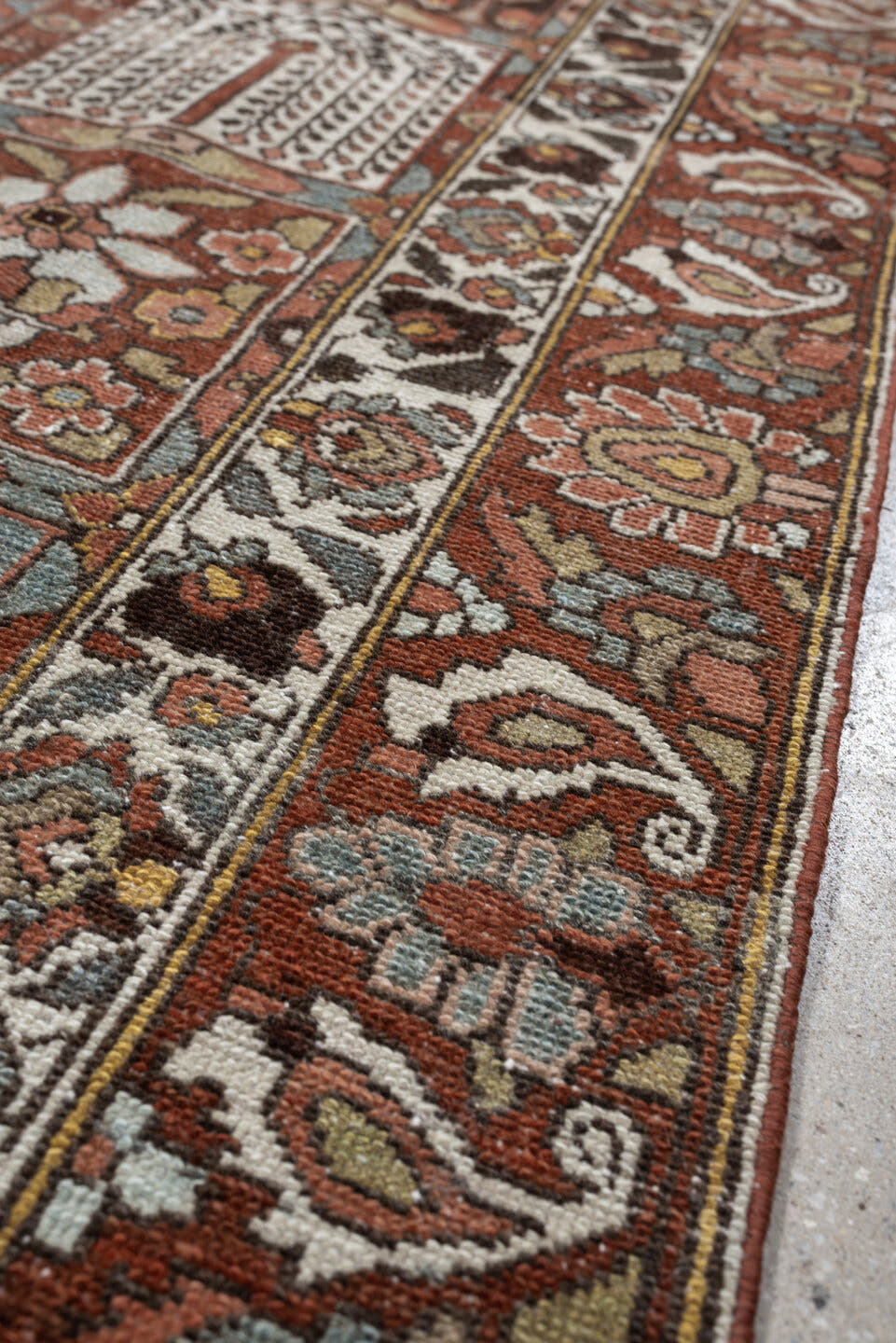 6' x 9' one-of-a-kind handmade antique Baktiary large size rug. Color palette: terracotta, ivory, blue gray, rust, brown