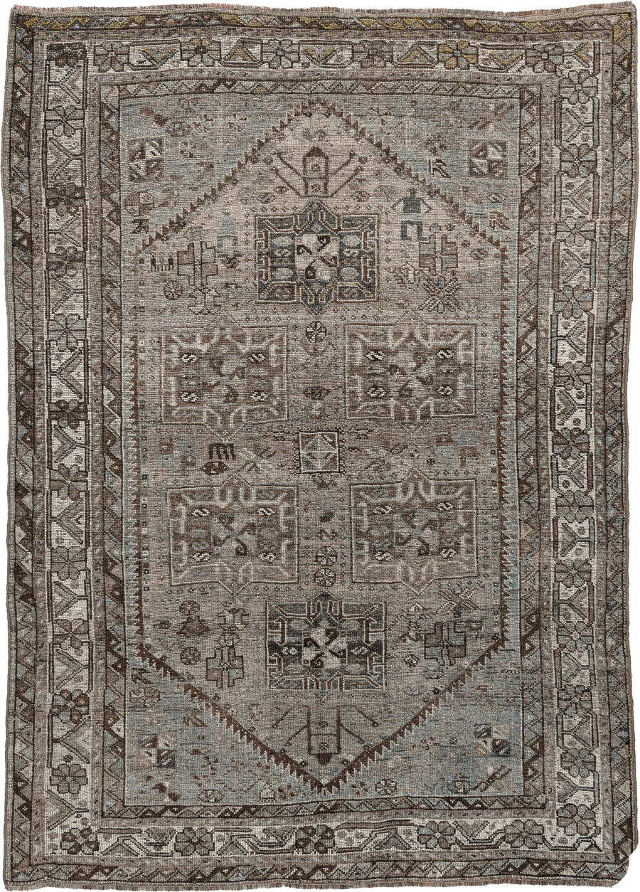 5' x 7' one-of-a-kind handmade antique Shiraz rug. Color palette: ivory, blue gray, taupe, brown, charcoal, sage, ochre