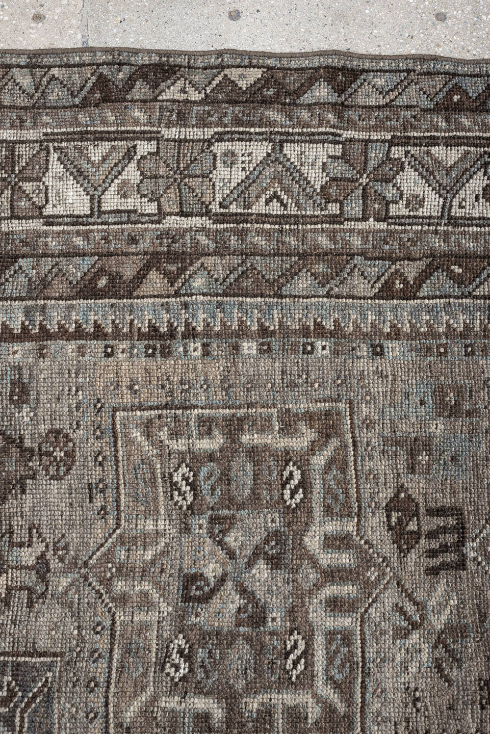 5' x 7' one-of-a-kind handmade antique Shiraz rug. Color palette: ivory, blue gray, taupe, brown, charcoal, sage, ochre