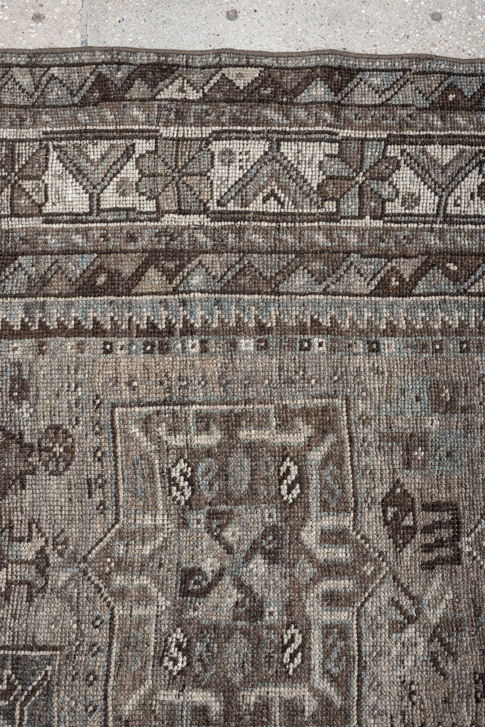 5' x 7' one-of-a-kind handmade antique Shiraz rug. Color palette: ivory, blue gray, taupe, brown, charcoal, sage, ochre