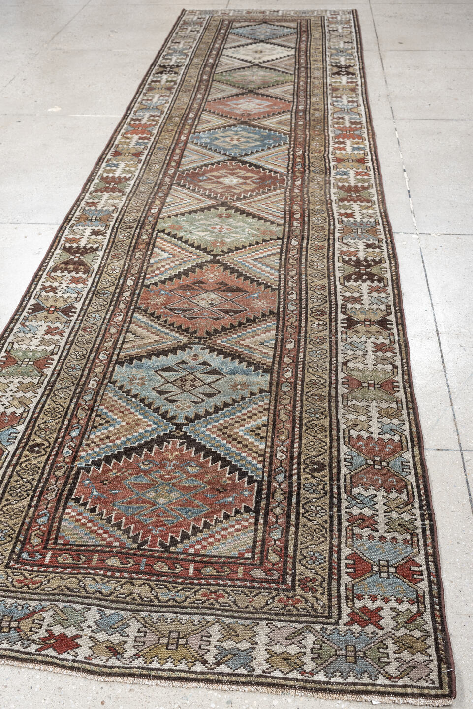 3' x 13' one-of-a-kind handmade antique NW Persian runner rug. Color palette: ivory, taupe, brown, slate blue, sage, rust