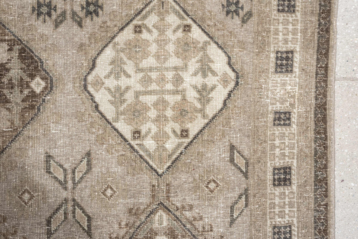 5' x 11' one-of-a-kind handmade antique Ardebil large size rug. Color palette: taupe, ivory, brown, charcoal, beige, camel