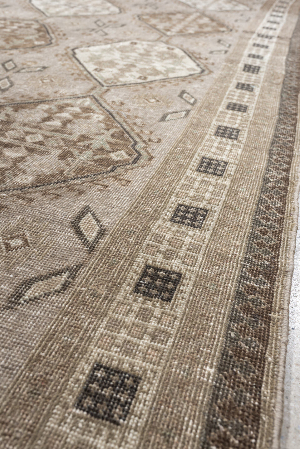 5' x 11' one-of-a-kind handmade antique Ardebil large size rug. Color palette: taupe, ivory, brown, charcoal, beige, camel