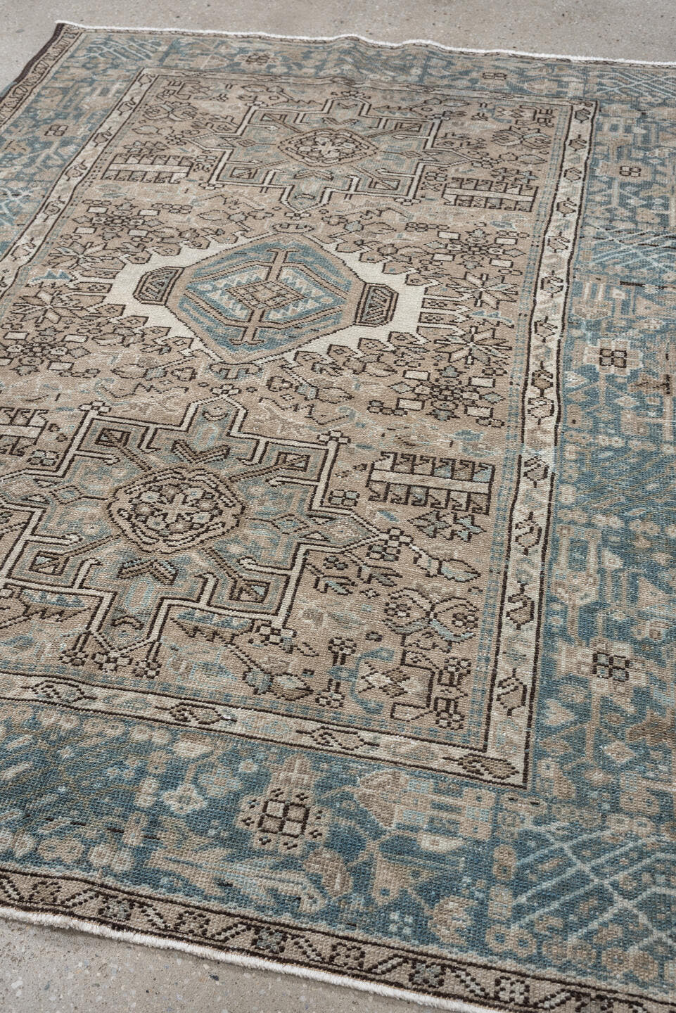 4' x 6' one-of-a-kind handmade antique Karaje rug. Color palette: ivory, powder blue, taupe, charcoal, brown, slate, cream