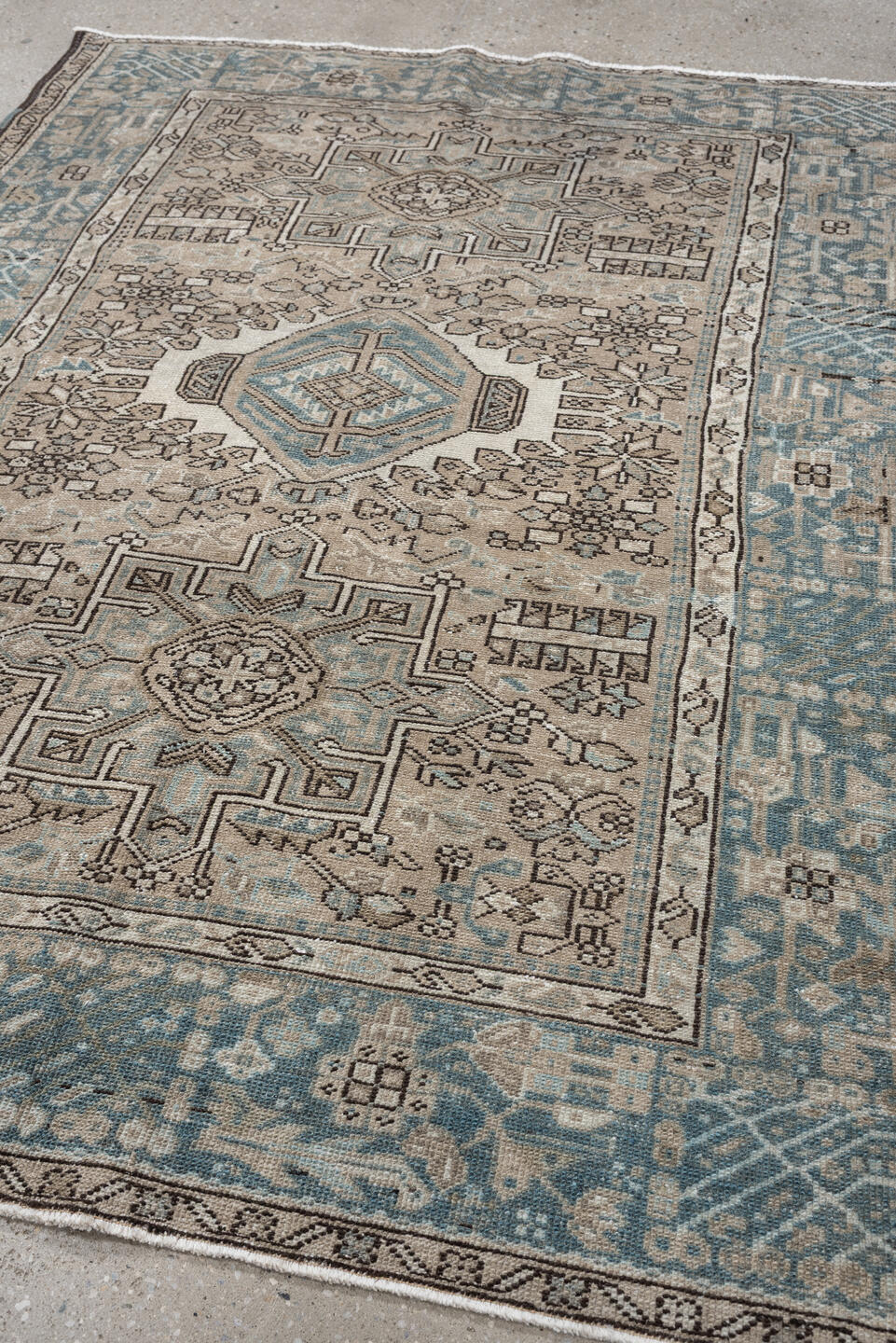4' x 6' one-of-a-kind handmade antique Karaje rug. Color palette: ivory, powder blue, taupe, charcoal, brown, slate, cream