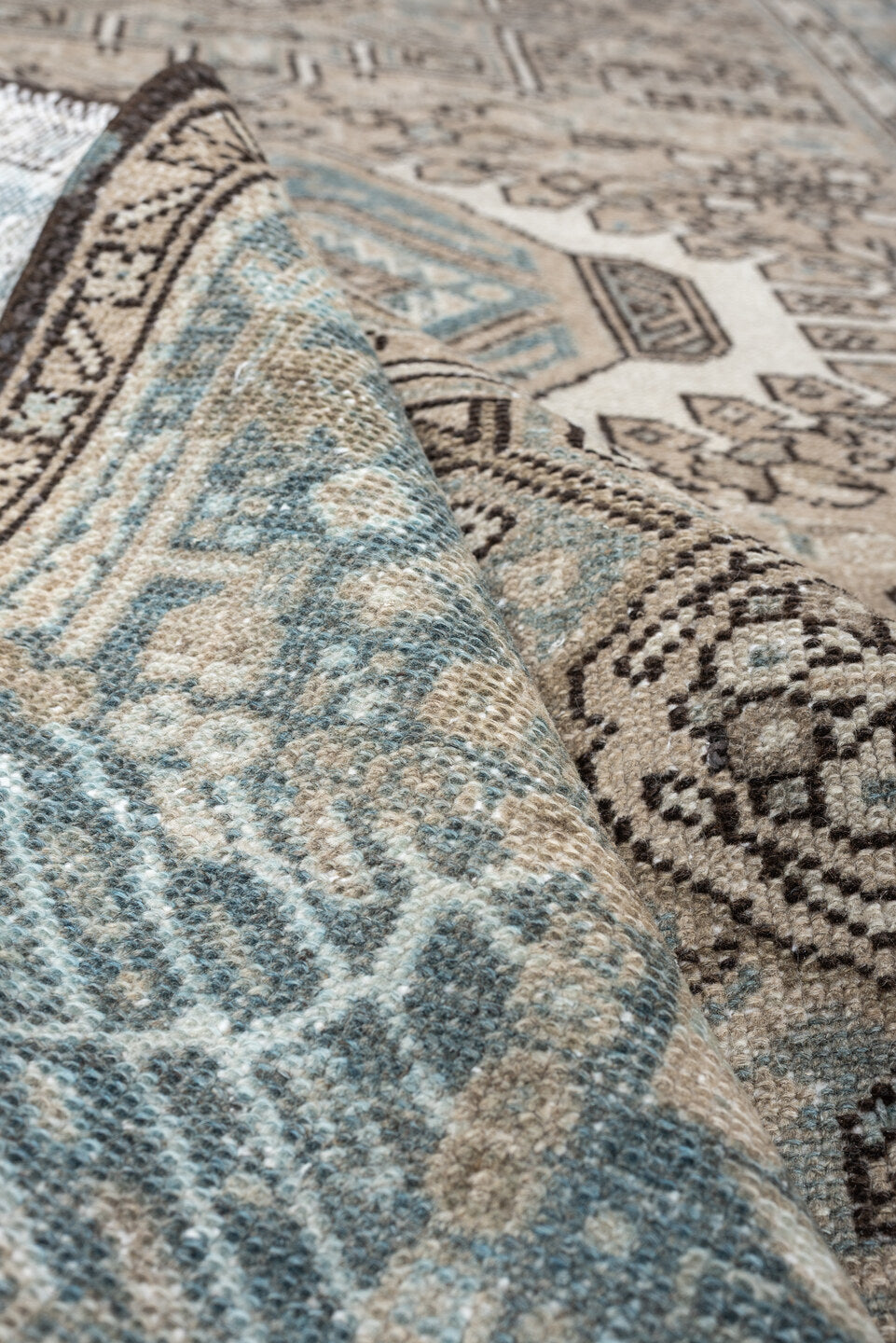 4' x 6' one-of-a-kind handmade antique Karaje rug. Color palette: ivory, powder blue, taupe, charcoal, brown, slate, cream