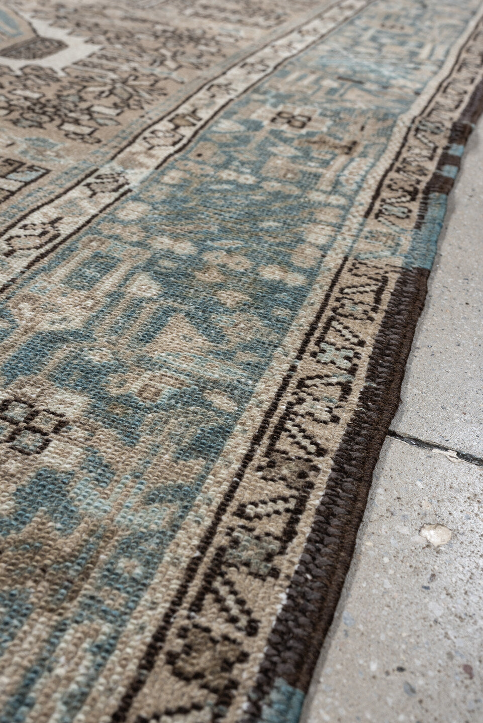 4' x 6' one-of-a-kind handmade antique Karaje rug. Color palette: ivory, powder blue, taupe, charcoal, brown, slate, cream