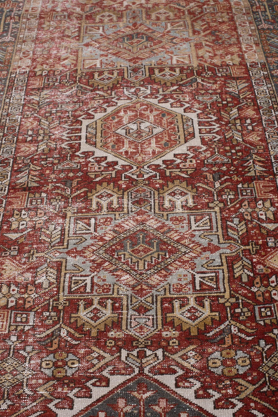 4' x 13' one-of-a-kind handmade antique Karaje runner rug. Color palette: rust, indigo, ivory, terracotta, charcoal, sienna