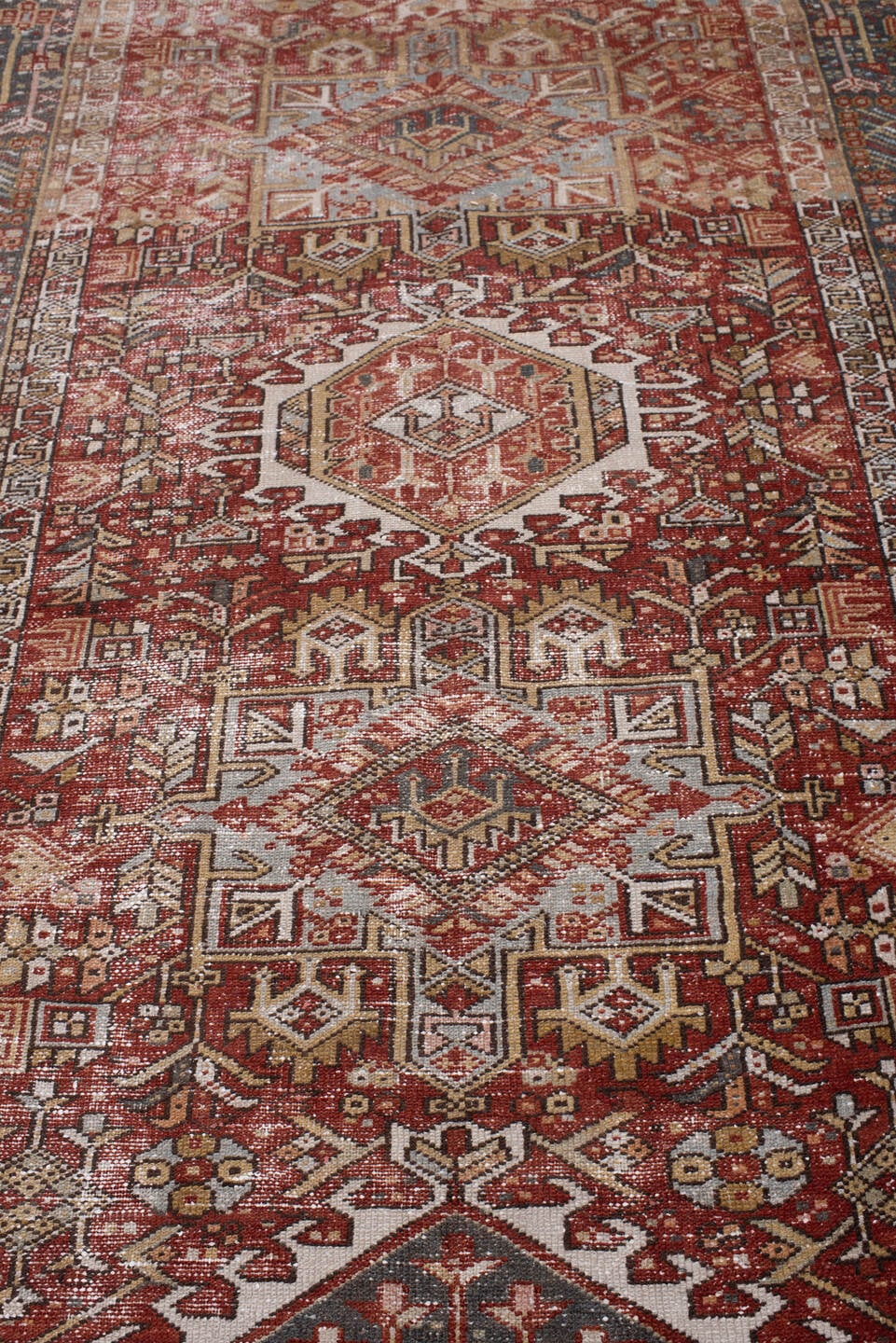 4' x 13' one-of-a-kind handmade antique Karaje runner rug. Color palette: rust, indigo, ivory, terracotta, charcoal, sienna